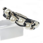Black Leather Cords with Large White Pearl Beads criss cross design. Magnetic clasp. 