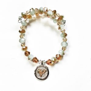 A bracelet with a heart charm and beads