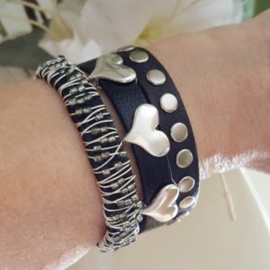 Three of my black and silver stacking bracelets on the arm. They all work together.