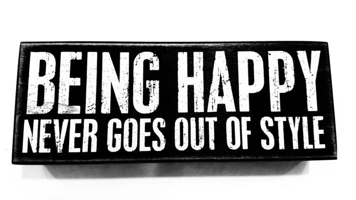 A sign that says being happy never goes out of style.