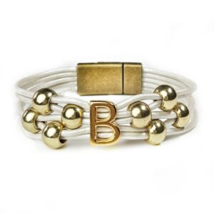 A white and gold bracelet with the letter b on it.