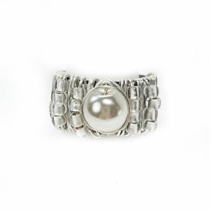 A silver ring with a pearl on it's side.