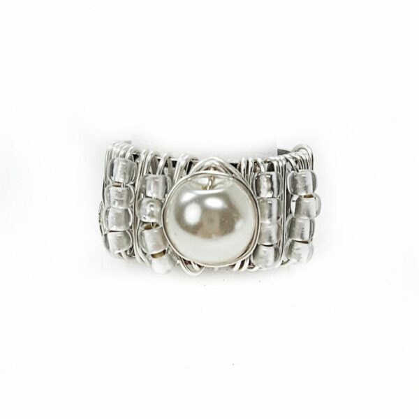 Adjustable silver ring with pearl center stone.