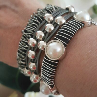 Gray stack bracelet set. Wire wrapped, leather cords with silver beads and wire wrapped with cabochon pearls.