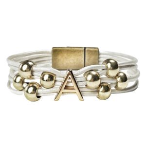 A bracelet with gold beads and an initial.