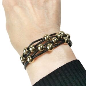 Black Leather Bracelet Gold Beads on wrist.