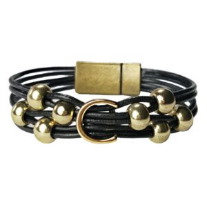 A black leather bracelet with gold beads and an id tag.