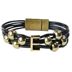 A black leather bracelet with gold beads and an initial.