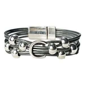 A bracelet with multiple strands of leather and metal beads.