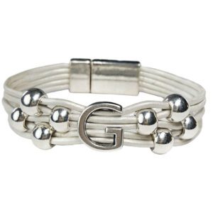 A white bracelet with silver beads and an initial g.