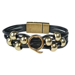 A black leather bracelet with gold beads and an animal charm.