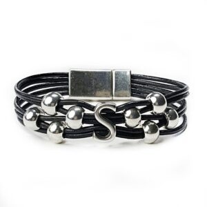 A black leather bracelet with silver beads and an initial.