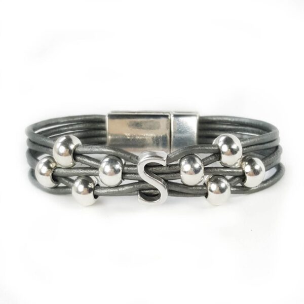 A gray leather bracelet with silver beads and an initial.