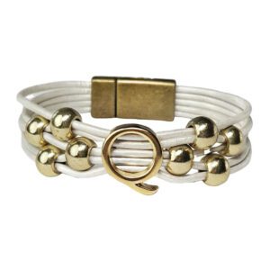 A white leather bracelet with gold beads and an opening.