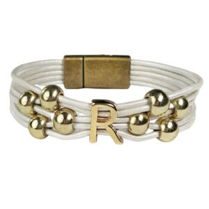 A white leather bracelet with gold beads and an initial.